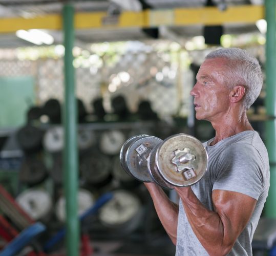Senior adult working out in a gym